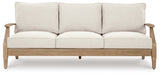 Ashley Furniture Carter Hall outdoor table set with a rectangular table and matching chairs in a modern patio design.