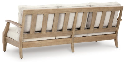 Outdoor table set by Ashley Furniture with a table and matching chairs, perfect for outdoor dining and gatherings.