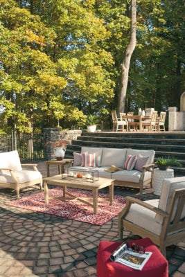 Ashley Furniture Carter Hall outdoor table set with a rectangular table and matching chairs, ideal for patio dining and outdoor gatherings.
