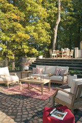 Ashley Furniture Carter Hall outdoor table set with a rectangular table and matching chairs, ideal for patio dining and outdoor gatherings.