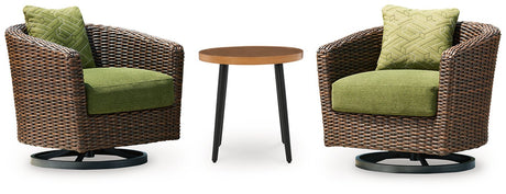 Outdoor table set from Ashley Furniture Horizon Hall Outdoor Package, featuring a spacious table and matching chairs in a patio setting.
