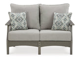 Ashley Furniture Visola outdoor sofa and loveseat set with matching outdoor table, featuring weather-resistant cushions and stylish design.