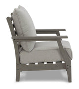 Ashley Furniture Visola outdoor sofa and loveseat set with a matching outdoor table, featuring cushioned seating and a stylish design.