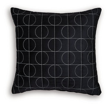 Set of four Ashley Furniture Kydner decorative pillows with patterned fabric and plush texture, arranged on a neutral-colored sofa.
