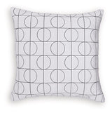 Set of four Ashley Furniture Kydner pillows with decorative fabric covers, arranged on a sofa for stylish comfort.
