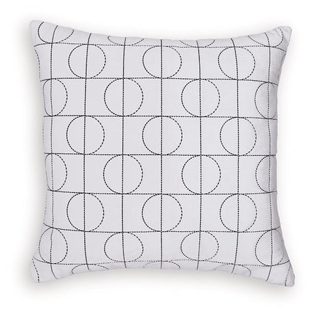 Set of four Ashley Furniture Kydner pillows with decorative fabric covers, arranged on a sofa for stylish comfort.