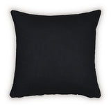 Set of four Ashley Furniture Kydner pillows with decorative patterns and neutral tones, arranged on a cozy sofa.