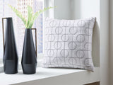Set of four Ashley Furniture Kydner decorative pillows with neutral fabric covers, perfect for enhancing living room décor.