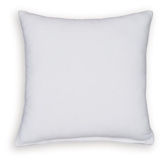 Set of four Ashley Furniture Kydner pillows featuring neutral fabric and decorative stitching, arranged on a cozy sofa.