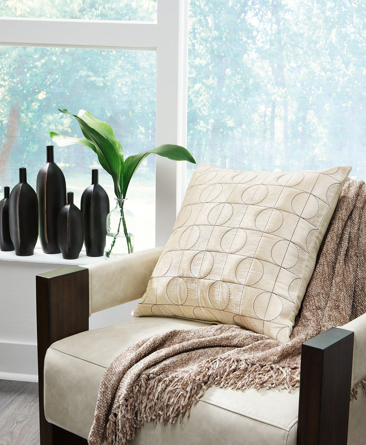 Set of four Ashley Furniture Kydner decorative pillows featuring soft fabric and stylish design for cozy home decor.
