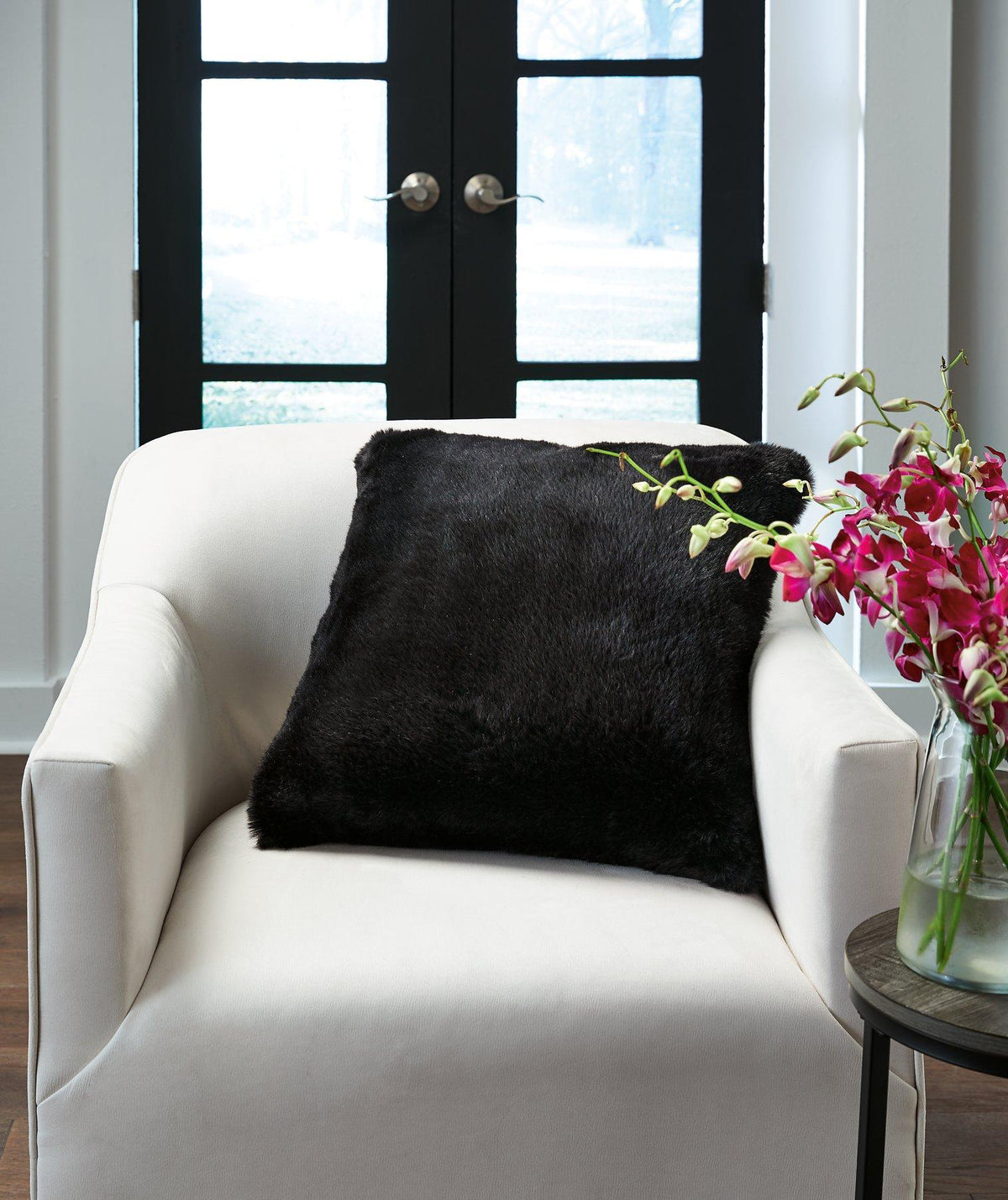 Ashley Furniture Gariland Pillow featuring soft fabric and decorative stitching, perfect for adding comfort and style to your living space.