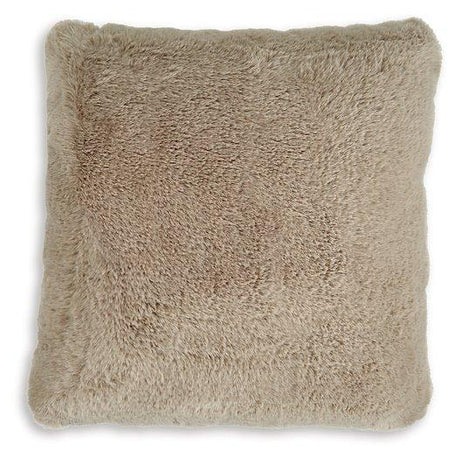 Ashley Furniture Gariland Pillow with soft fabric and decorative design, shown on a cozy living room sofa.