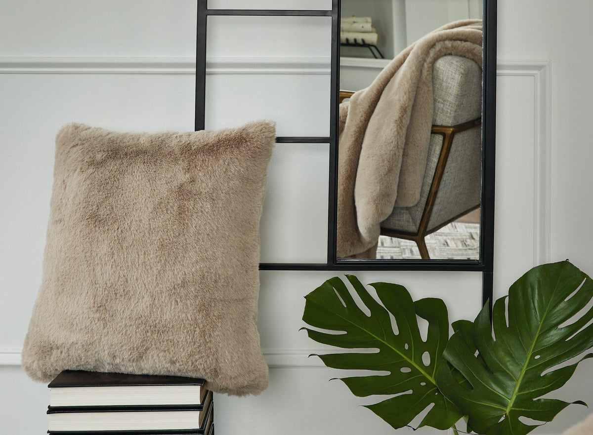 Ashley Furniture Gariland Pillow showing a plush, decorative pillow with textured fabric and neutral tones.