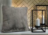 Ashley Furniture Gariland Pillow with soft fabric cover and plush filling, ideal for decorative or restful use.