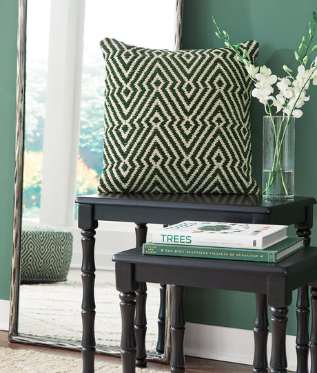 Set of four Ashley Furniture Digover pillows featuring soft fabric and decorative patterns, perfect for sofa or bed decor.