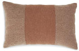 Set of four Ashley Furniture Dovinton pillows with textured fabric and neutral tones, displayed on a cozy sofa.
