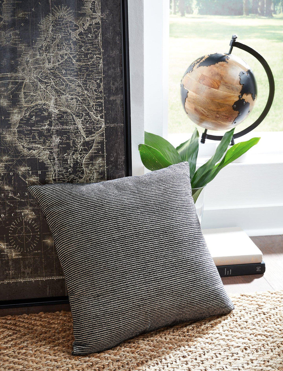 Ashley Furniture Edelmont Pillow featuring soft fabric and decorative design, perfect for enhancing home decor.