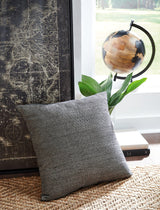Ashley Furniture Edelmont Pillow featuring soft fabric and decorative design, perfect for enhancing home decor.