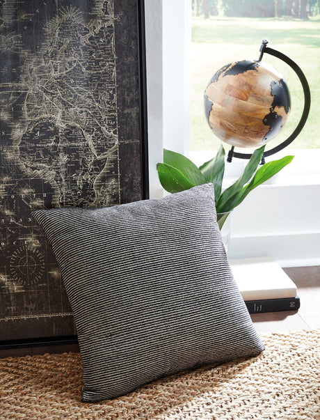 Ashley Furniture Edelmont Pillow featuring soft fabric and decorative design, perfect for enhancing home decor.