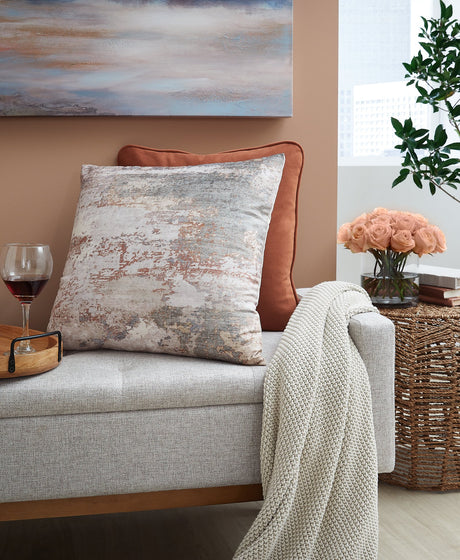 Set of four Ashley Furniture Edinfielders pillows with decorative patterns and plush fabric for stylish home décor.