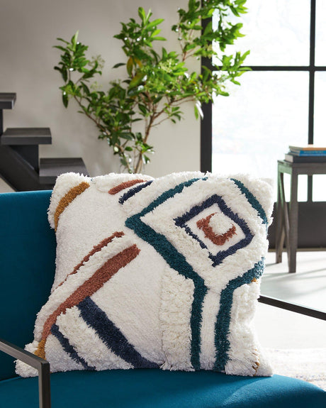 Soft Evermore Pillow by Ashley Furniture with plush fabric and decorative stitching, perfect for cozy living room decor.