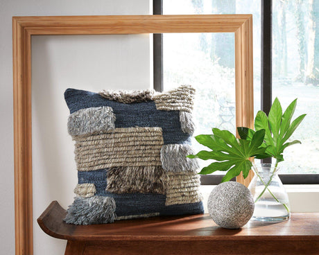 Set of four Ashley Furniture Gibbend pillows featuring textured fabric and decorative patterns for cozy living room decor.