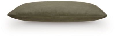 Set of four Ashley Furniture Danvale pillows with decorative beige and brown patterns, shown in a cozy living room setting.