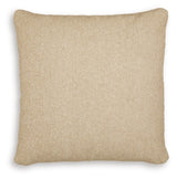 Set of four Ashley Furniture Macsen pillows with decorative fabric covers, arranged in a cozy living room setting.