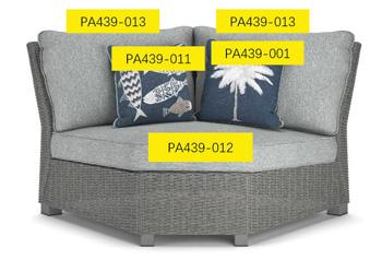 Ashley Furniture Naples Beach Pillow showcasing a decorative pillow with coastal-inspired design and soft fabric.