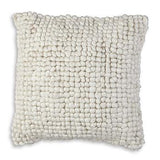 Ashley Furniture Aavie Pillow featuring soft, plush fabric and decorative stitching for comfortable support and stylish decor.