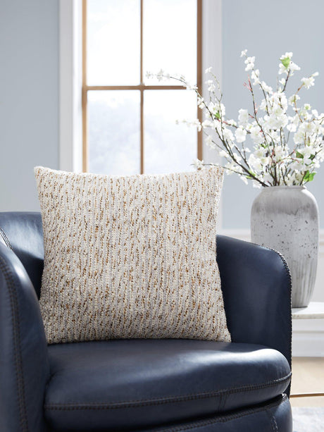 Ashley Furniture Abler Pillow featuring soft fabric and decorative stitching, perfect for adding comfort to living spaces.
