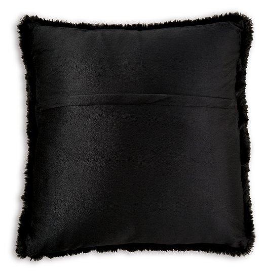 Set of four Ashley Furniture Gariland pillows with neutral fabric covers, arranged on a sofa for cozy home decor.