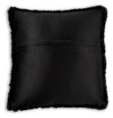 Set of four Ashley Furniture Gariland pillows with neutral fabric covers, arranged on a sofa for cozy home decor.