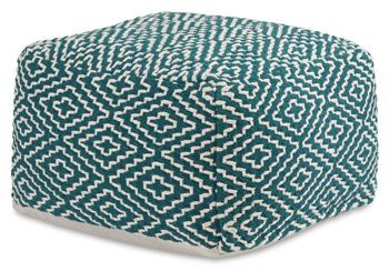 Ashley Furniture Brynnsen Pouf, soft fabric upholstery and round shape, used as a footrest or accent piece in living room decor.