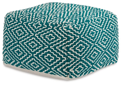 Ashley Furniture Brynnsen pouf with soft fabric upholstery and a modern round design, shown from an angled side view.