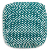 Ashley Furniture Brynnsen pouf with soft fabric and tufted top, perfect for living room or bedroom decor.