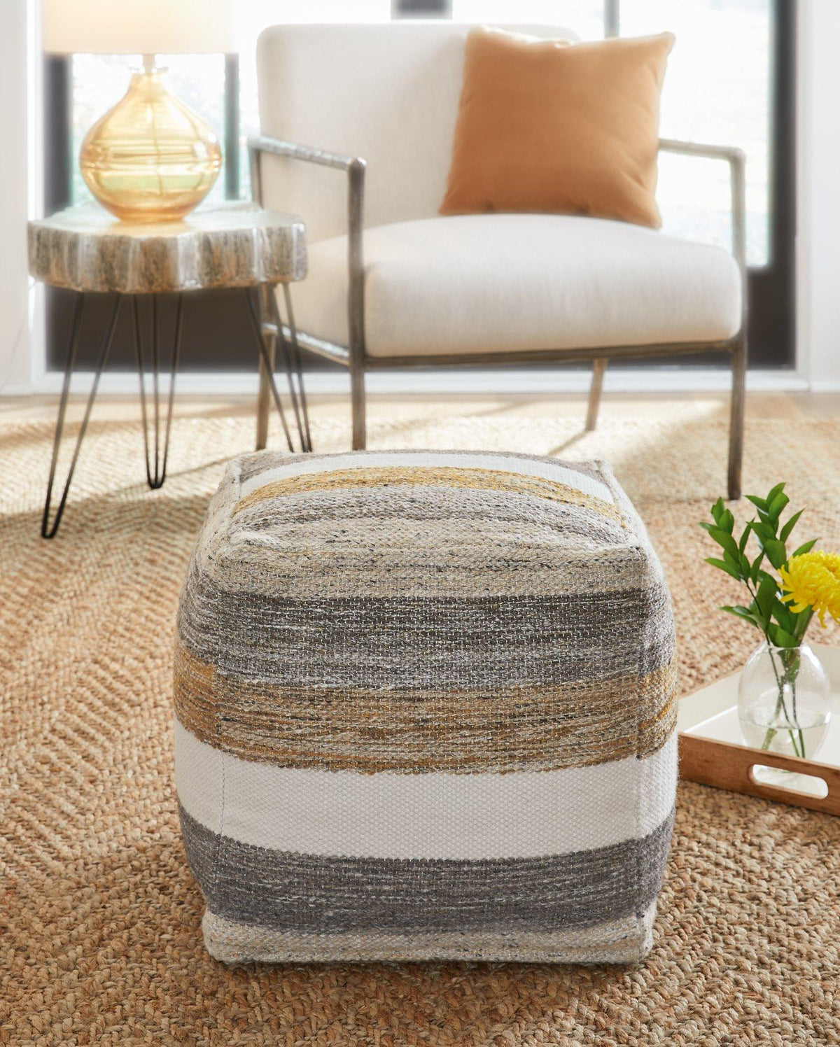 Ashley Furniture Josalind pouf, soft fabric with tufted design, versatile accent piece for living room or bedroom decor.