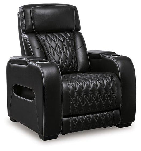 Ashley Boyington Power Recliner in brown fabric, showing plush cushioning and built-in reclining mechanism.