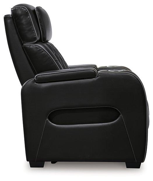 Boyington power recliner by Ashley Furniture, showing plush fabric, padded armrests, and reclining mechanism in a modern living room setting.