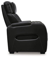 Boyington power recliner by Ashley Furniture, showing plush fabric, padded armrests, and reclining mechanism in a modern living room setting.