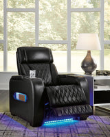 Ashley Boyington Power Recliner in dark gray fabric with plush cushioning and built-in recline mechanism, perfect for relaxing.