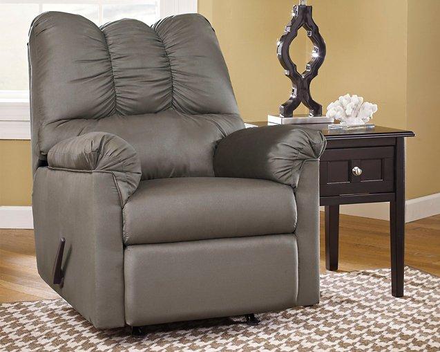 Ashley Furniture Darcy recliner with plush fabric upholstery and padded armrests, shown in a comfortable, modern living room setting.