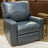 Ashley Furniture Torino manual rocker recliner chair with cushioned armrests and plush fabric for comfortable seating.