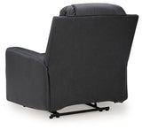 Ashley Furniture Mackmenville recliner with plush fabric upholstery and padded armrests, shown from the back in the image.