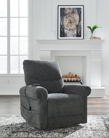 Ashley Furniture Aureta Power Lift Recliner in beige fabric, featuring plush cushioning and a sturdy frame for comfortable relaxation.