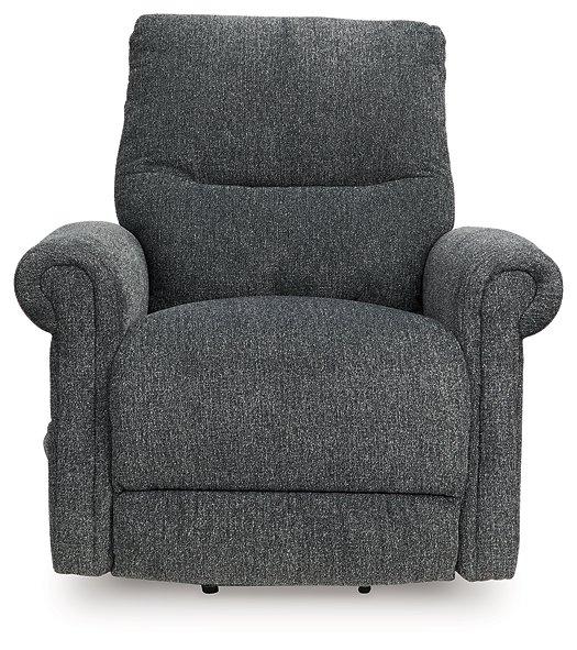 Ashley Furniture Aureta Power Lift Recliner in neutral fabric, showcasing its plush cushioning and sturdy wooden base.