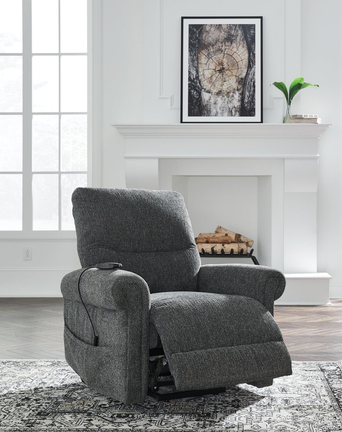 Ashley Furniture Aureta Power Lift Recliner in beige fabric, with plush cushioning and a reclining footrest.
