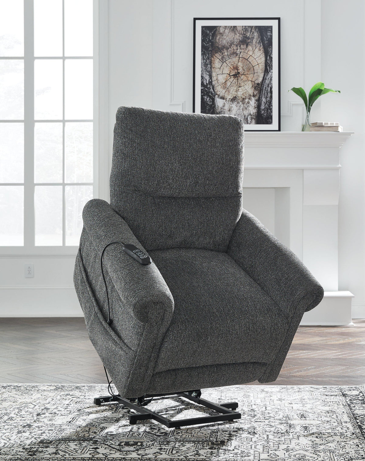 Ashley Furniture Aureta Power Lift Recliner showing plush upholstery, padded armrests, and reclining mechanism.