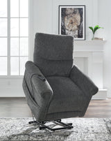 Ashley Furniture Aureta Power Lift Recliner showing plush upholstery, padded armrests, and reclining mechanism.