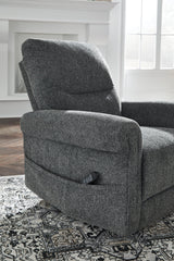 Ashley Furniture Aureta power lift recliner with plush upholstery and padded armrests, shown in a relaxed reclined position.